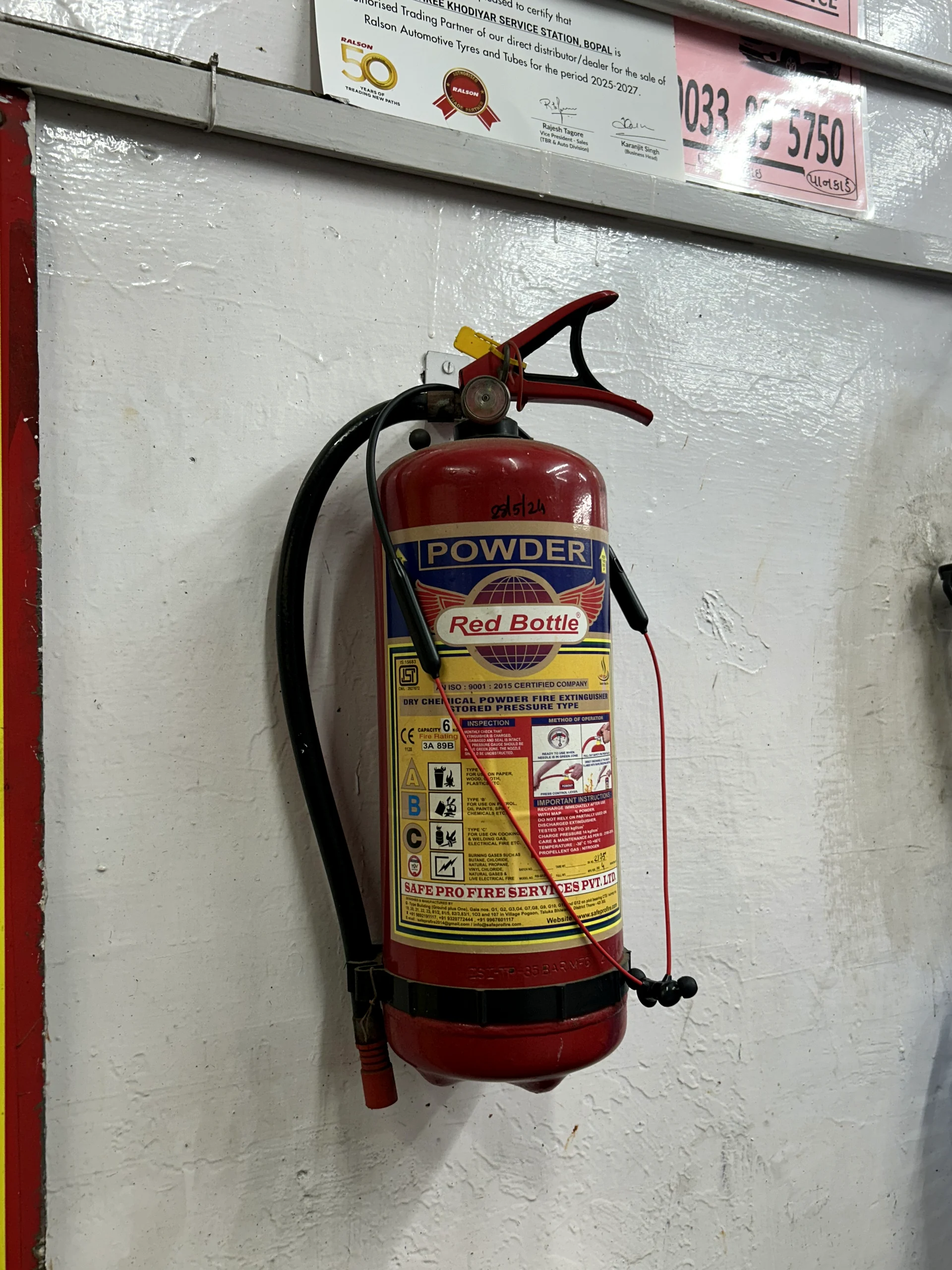 Fire extinguisher mounted inside the workshop